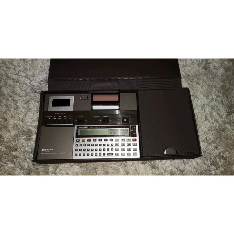 Sharp CE-125 calculator printer and micro cassette
