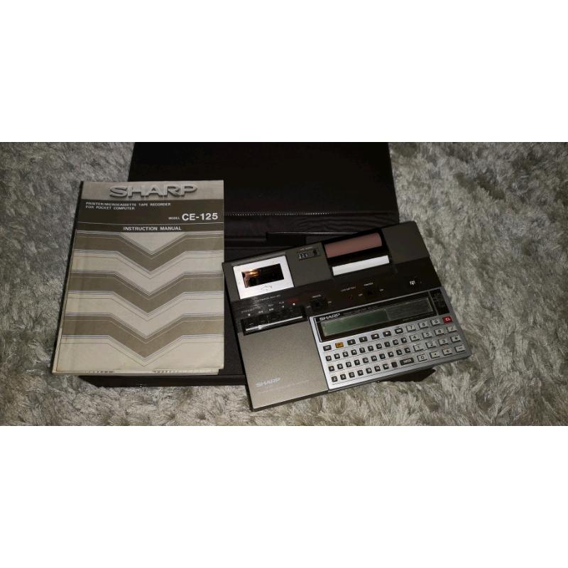 Sharp CE-125 calculator printer and micro cassette